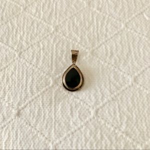 Black teardrop pendant with silver outline frame